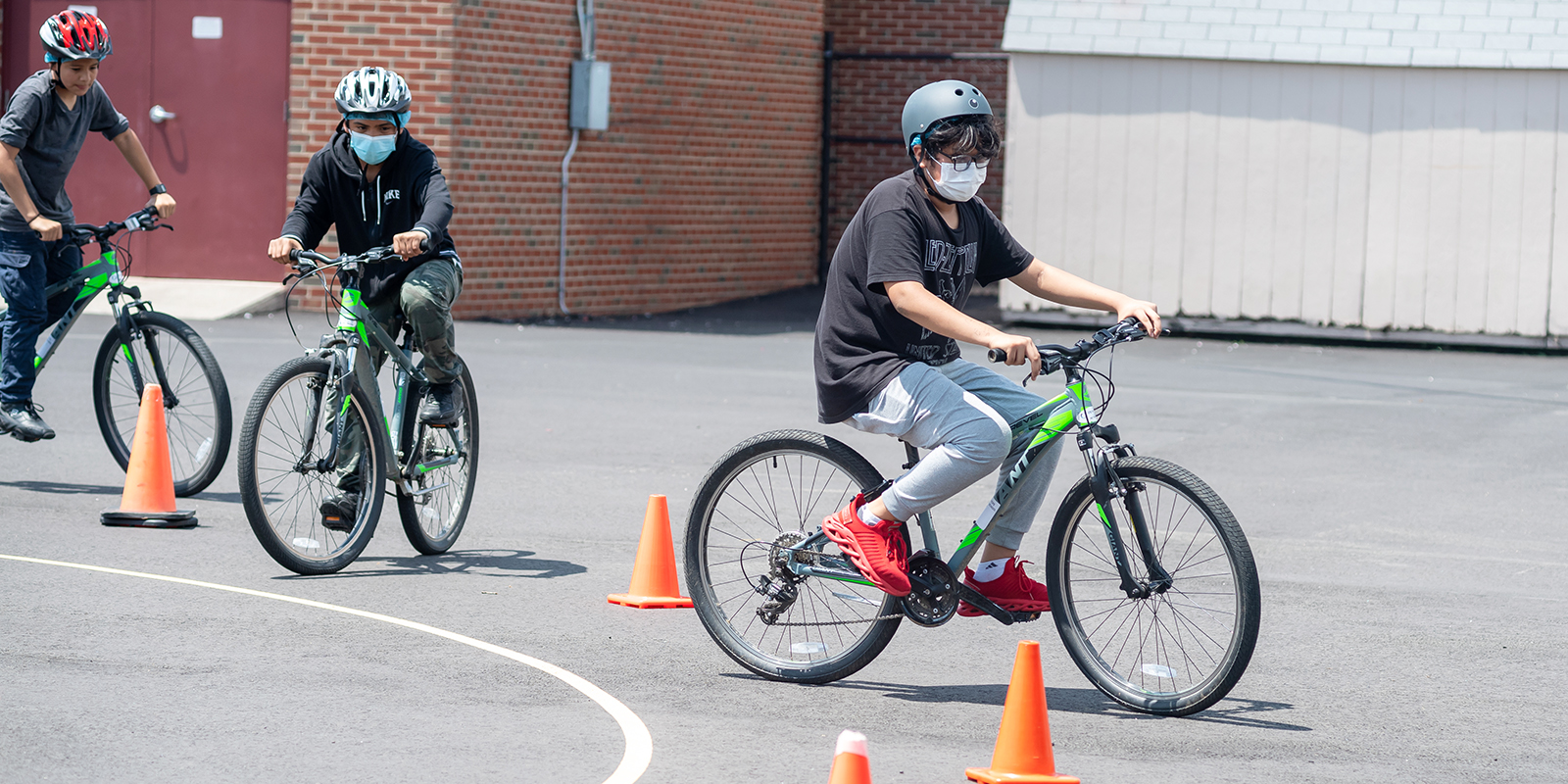 Poe MS sixth-graders navigate a bike around cones.